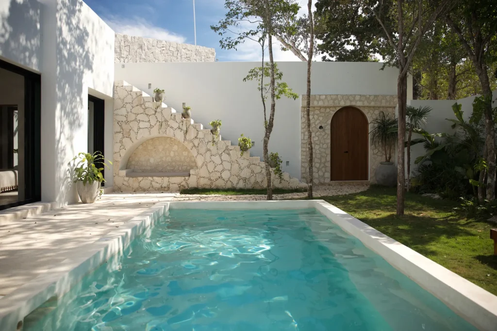 Courtyard with pool and white stone walls
