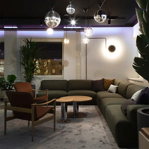 Modern lounge area with cozy lighting and contemporary furniture.